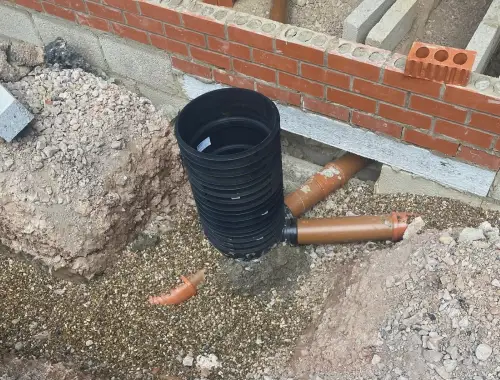 Drainage installation and groundwork construction for foul and surface water systems in London.